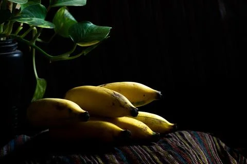A bunch of Yellow banana with selective lighting Stock Photos