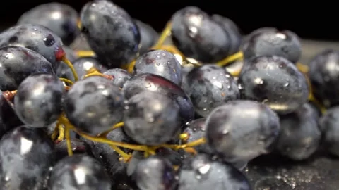 Bunches of grapes close-up on a rotating surface Stock Footage 165076945