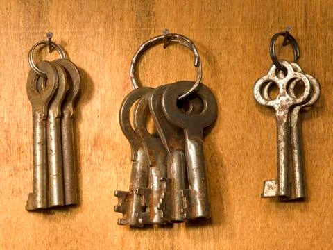 The bunches of old rusty keys. Stock Photos