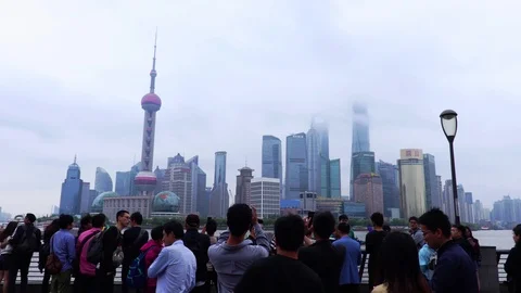 The Bund or Waitan in central Shanghai, China. Tourists looking at skyscrapers Video stock 98418092