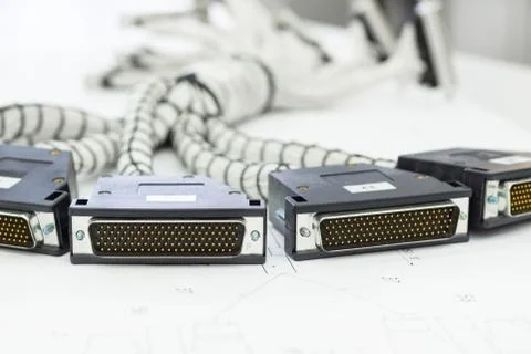 A bundle of cable harnesses lies on the table. Stock Photos