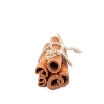 Bundle of cinnamon sticks on white background. Stock Photos