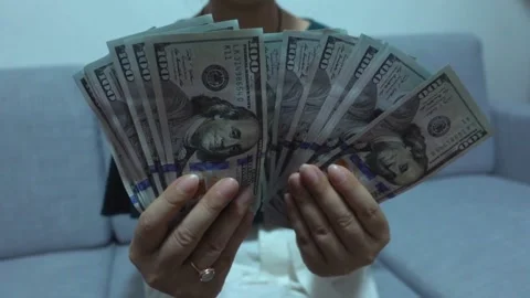 A bundle of dollar bills in female hands. Counting savings, salaries and in.. Stock Footage 266470937