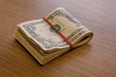 Bundle of Dollar Notes on Table Stock Photos