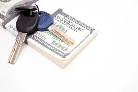 Bundle of dollars and key on white background Stock Photos