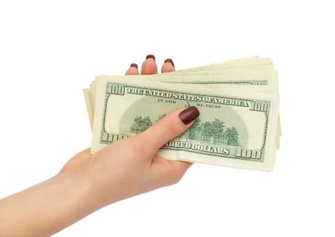 Bundle of dollars in female hand Foto stock