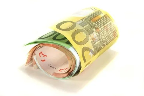 A bundle of euro notes in front of a white background Foto stock