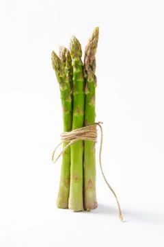 Bundle of fresh asparagus on white background Stock Photos