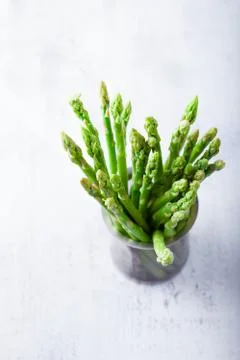 Bundle of green asparagus on the table Stock Photos