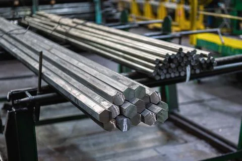 A bundle of hexagonal metal bars, steel mill products Stock Photos