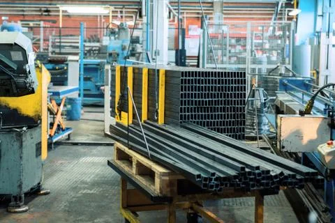 A bundle of metal rectangular profile. Industrial interior Stock Photos