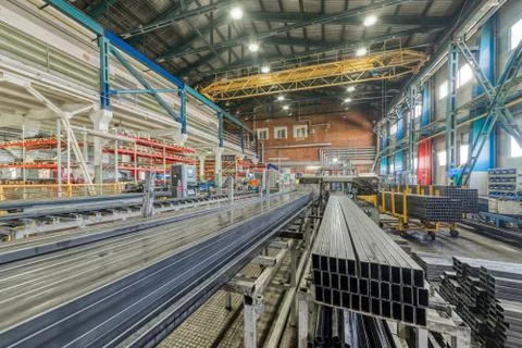 A bundle of metal rectangular profile. Industrial interior Foto stock