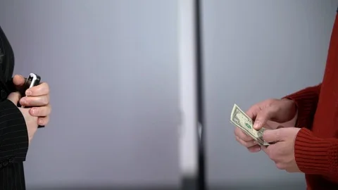 A bundle of money on the table, a lot of dollars in their hands, business people Stock Footage 100372037