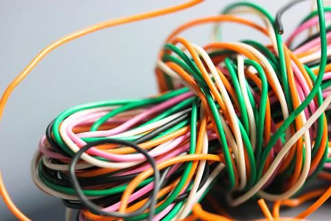 A bundle of multicolored electrical, car, computer, telephone twisted wires. Foto stock