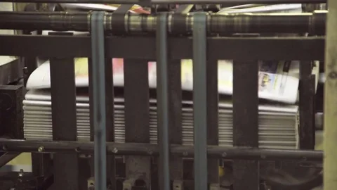 Bundle of newspapers in machine stored paper lot in printing house Stock Footage 71559057