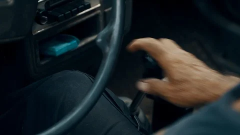 A bundle of old car shots. Manual Gear Shift and Releasing Hand Brake Stock Footage 91179962