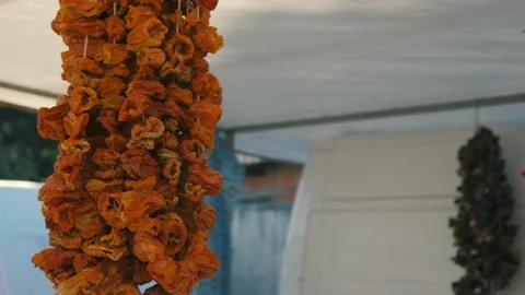 Bundle of red peppers dry in the sun. Stock Footage 168821873