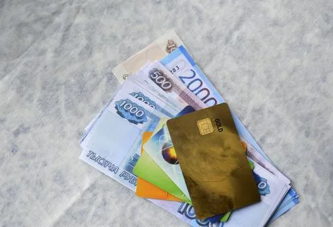 Bundle of Russian rubles banknotes and bank plastic credit cards Stock Photos