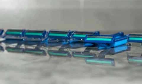 A bundle of sharp and new shaving razors in blue color Stock Photos