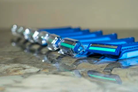 A bundle of sharp and new shaving razors in blue color Foto stock