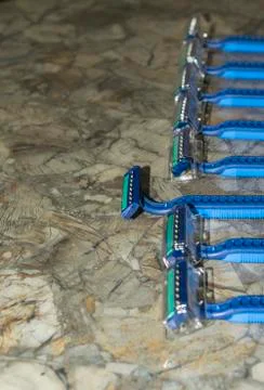 A bundle of sharp and new shaving razors in blue color Stock Photos