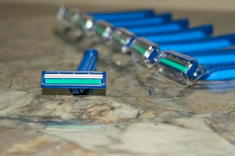 A bundle of sharp and new shaving razors in blue color Stock Photos