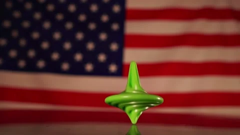 The bundle spins and then falls against the background of the American flag. Stock Footage 132352097