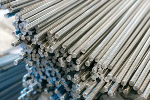A bundle of stainless steel bars. Large industrial warehouse metal Stock Photos