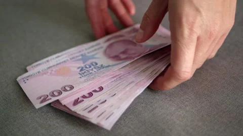A bundle of Turkish lira banknotes with a denomination of two hundred lira lies Stock Footage 229477241