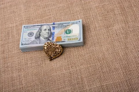 Bundle of US dollar and a heart shape Foto stock