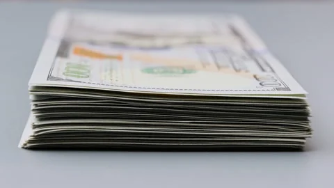 Bundle of US dollars increases one by one. Growing up stack of american dollars Stock Footage 220441443