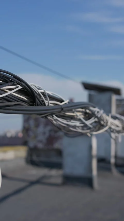 Bundled Data Communication Cables Stretching Across Urban Rooftop Stock Footage 347544903