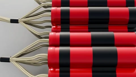 A bundled red dynamite sticks with black tape and white fuses. 動画素材 329811548