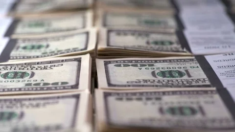 Bundles of dollar bills stacked in rows Stock Footage 83331884