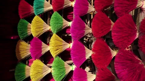 Bundles of multi-colored bamboo sticks for incense making in Vietnam 스톡 동영상 248406014