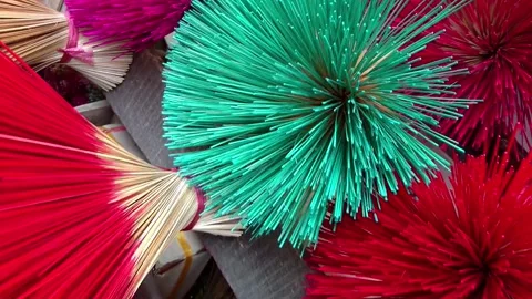Bundles of multi-colored bamboo sticks for incense making in Vietnam 스톡 동영상 248406016
