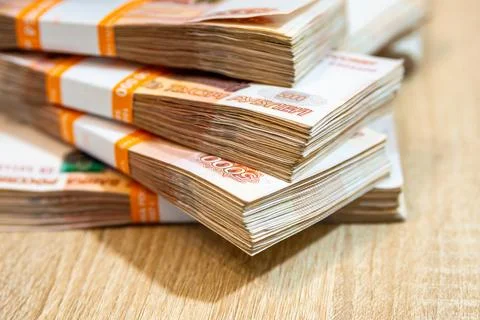 Bundles of ruble banknotes on the table Stock Photos
