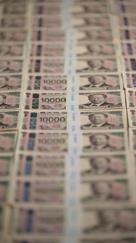 Bundles of yen banknotes lined up with paper bands Stock Footage 336765966