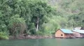Bungalows on the Kwai river in northwestern Thailand HD Footage