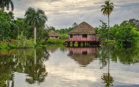 Bungalows on the river in the rainforest Stock Photos