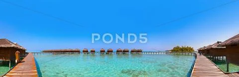 Bungalows on tropical Maldives island Stock Photos