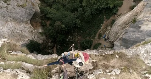 Bungee jump in a cave. Aerial view, 4k superwide Stock Footage 82645801