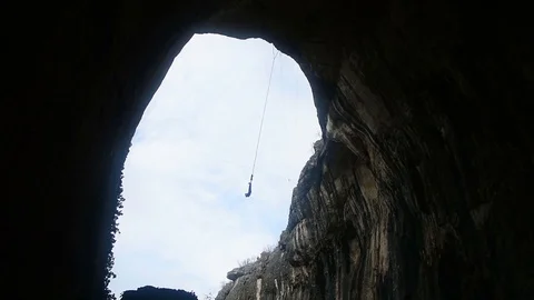 Bungee jump in a cave. Stock Footage 82641604