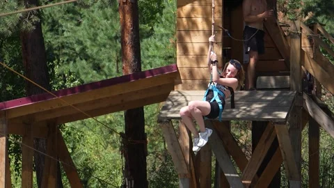 Bungee jump, jumping on a bungee over a mountain river in Altai Stock Footage 294665203