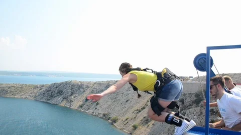 Bungee jump Maslenica bridge. Jump off a bridge with a rope. Stock Footage