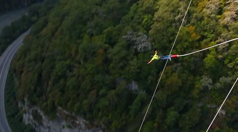 Bungee jump, men facing forward from the bridge with 207m Stock Footage 44763417