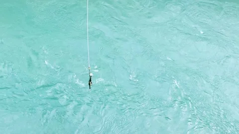 Bungee Jump Over Turquoise River in Queenstown Stock Footage 310073677