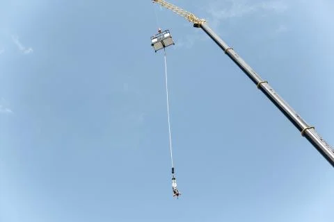 Bungee jumping with a crane. Stock Photos