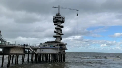 Bungee jumping from a tower at Scheveningen beach. The Hague, Netherlands Stock Footage 287579752