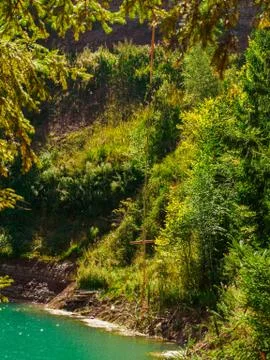 Bungee stick against the background of forest lake coastline. Stock Photos